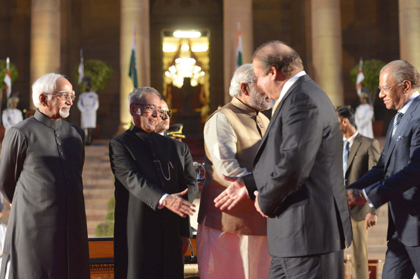 Prime Minister Narendra Modi being greeted by Prime Minister of Pakistan Nawaz Sharif after the swearing-in ceremony at Rashtrapati Bhavan, in New Delhi on May 26, 2014