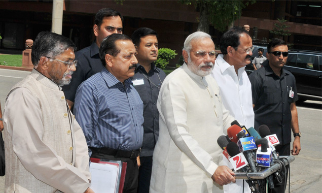 Prime Minister Narendra Modi addressing the media outside the Parliament House along with his Ministerial colleagues