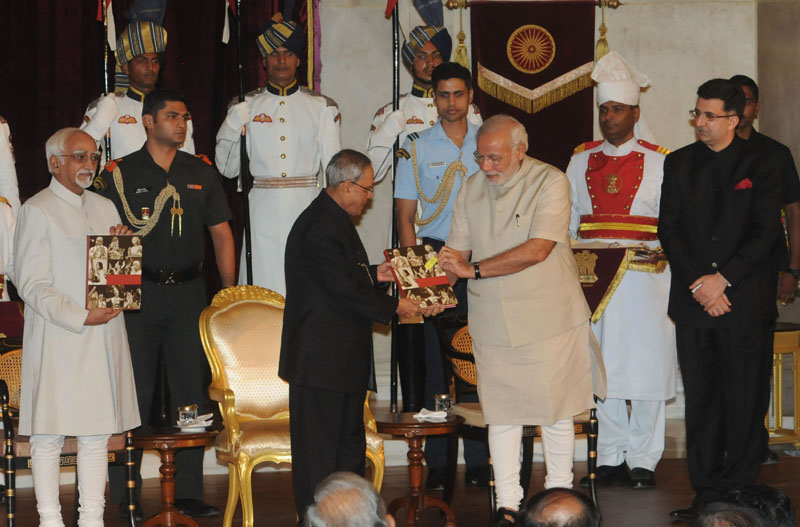 The Prime Minister, Shri Narendra Modi releasing a book &lsquo;Indradhanush&rsquo; on the cultural events organized in Rashtrapati Bhavan and presented to the President, Shri Pranab Mukherjee, on completion of two years of his Presidency, at a function, at Rashtrapati Bhavan, in New Delhi on July 25, 2014
